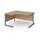 Dams Contract 25 ergonomic oak desk with cantilever leg, featuring a spacious surface and modern design in Kendal Oak finish.