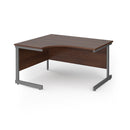 Dams Contract 25 ergonomic walnut desk with cantilever legs, featuring a spacious work surface and modern design.