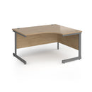Dams Contract 25 ergonomic desk with Kendal Oak finish and cantilever leg design, showcasing a spacious office workspace