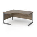 Dams Contract 25 ergonomic desk with Nebraska oak finish and cantilever legs, featuring a spacious work surface and modern design.