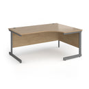 Dams Contract 25 ergonomic desk with cantilever legs in Kendal Oak finish, showcasing its spacious work surface and modern design.