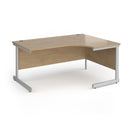 Dams Contract 25 ergonomic desk with Kendal Oak finish and cantilever legs, showcasing a modern office workspace setup.