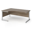 Dams Contract 25 ergonomic desk with Nebraska Oak finish and cantilever legs, featuring a spacious work surface and modern design.