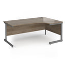 Dams Contract 25 ergonomic desk with Nebraska Oak finish and cantilever legs, featuring a spacious work surface and modern design.
