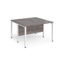 Dams Maestro 25 600mm deep back-to-back straight desks with bench leg in grey oak finish, showing clean, modern workspace setup.