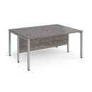 Dams Maestro 25 600mm deep back-to-back straight desks with bench leg in grey oak finish, showing sleek office workspace setup.