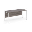 Dams Maestro 25 600mm deep straight desk with grey oak finish and bench leg, featuring a modern office workspace setup.
