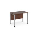 Dams Maestro 25 600mm deep straight desk with bench legs in walnut finish, featuring a spacious workspace and modern design.