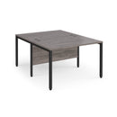 Dams Maestro 25 800mm deep back-to-back straight desks with bench legs in grey oak, showing a modern office workspace setup