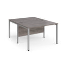 Dams Maestro 25 800mm deep back-to-back straight desks with bench legs in grey oak finish, showing a modern office workspace setup.