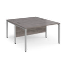 Dams Maestro 25 800mm deep back-to-back straight desks with bench legs in grey oak finish, showing the desks and sturdy frames.