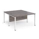 Dams Maestro 25 800mm deep back-to-back straight desks with bench legs in grey oak finish, showcasing modern office workspace.
