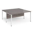 Dams Maestro 25 800mm deep back-to-back straight desks with bench legs in grey oak finish, showcasing their modern office design.