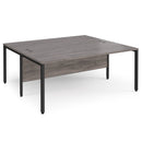 Dams Maestro 25 800mm deep back-to-back straight desks with bench leg in grey oak finish, showing the sleek tabletop and sturdy legs.