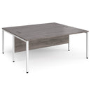 Dams Maestro 25 800mm deep back-to-back straight desks with bench legs in grey oak finish, ideal for office workspace arrangement.