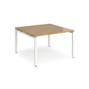 Dams Adapt back-to-back desks with 600mm depth in oak finish, featuring clean lines and sturdy construction for office workspace.