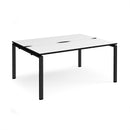 Dams Adapt Back to Back Desks with 600mm depth in white and black, showing a modern workspace setup with dual desks.