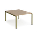 Dams Adapt back-to-back desks with 800mm depth in oak finish, showing sleek wooden surfaces and modern office setup.