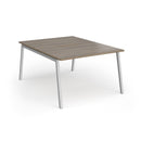 Dams Connex Plus Angled Back To Back Desk in Nebraska Oak wood with modern design and spacious workspace.