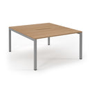 Dams Connex scalloped back-to-back desks in beech wood, showing the sleek, modern design with smooth edges and polished finish.