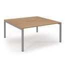 Dams Connex scalloped back-to-back desks in beech finish, featuring modern design and smooth surfaces for office workspace.