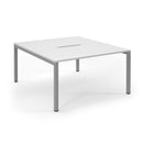 White Connex scalloped back-to-back desks by Dams, showing the sleek, modern design and spacious work surfaces.