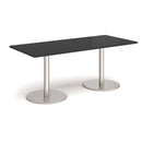 Black Monza rectangular dining table by Dams with a flat round base, showcasing a modern, sleek design.