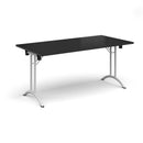 Black rectangular folding leg table with curved foot rails by Dams, showing the table's surface and sturdy metal legs.