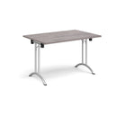 Dams rectangular folding leg table with curved foot rails in grey oak finish, showcasing its sturdy design and smooth surface.