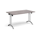 Dams rectangular folding leg table in grey oak finish with curved foot rails, showcasing its sturdy design and smooth surface.
