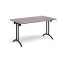 Dams grey oak rectangular folding leg table with curved foot rails, showcasing its sturdy design and smooth folding mechanism.