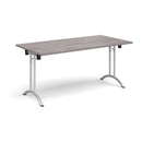 Dams rectangular folding leg table with curved foot rails in grey oak finish, showing the sturdy table surface and foldable legs.