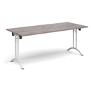 Dams rectangular folding leg table in grey oak finish with curved foot rails, showcasing a sturdy, practical design.