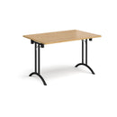 Rectangular folding leg table with curved foot rails in oak wood, featuring a natural finish and sturdy metal frame by Dams.