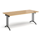 Dams rectangular folding leg table with curved foot rails in oak finish, featuring a sturdy wooden surface and foldable design.