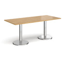Dams Pisa rectangular oak dining table with round chrome bases, showcasing a modern wooden tabletop and sleek metallic supports.