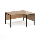 Dams Maestro 25 ergonomic desk with bench leg in beech finish, shown from the left side with black frame and clean workspace.