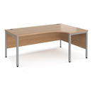 Dams Maestro 25 ergonomic desk with bench leg in beech finish, shown from the left side with black frame and smooth workspace surface.