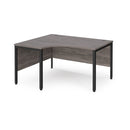 Dams Maestro 25 ergonomic desk with bench leg in grey oak finish, featuring a spacious workspace and modern design.