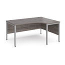 Dams Maestro 25 ergonomic desk with grey oak finish and bench leg design, featuring a spacious work surface and modern style.