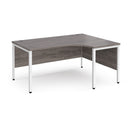 Dams Maestro 25 ergonomic desk with bench leg in grey oak finish, featuring a spacious workspace and modern design.