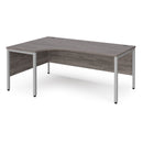 Dams Maestro 25 ergonomic desk with bench leg in grey oak finish, showcasing sleek modern office workspace design.