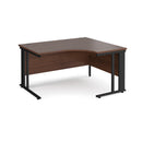 Dams Maestro 25 ergonomic desk with walnut finish and cable-managed leg, shown from the left side.