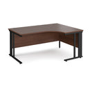 Dams Maestro 25 ergonomic desk with cable-managed leg in walnut finish, shown from left side.