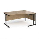 Dams Maestro 25 ergonomic desk with Kendal Oak finish and cantilever legs, showcasing a sleek workspace setup with clean lines.