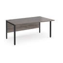 Dams Maestro 25 Wave Desk with bench leg in grey oak finish, showcasing a modern office workspace with sleek design elements.
