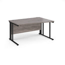 Dams Maestro 25 Wave desk in grey oak with cable-managed leg, featuring a modern wave-shaped tabletop and sleek design.