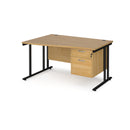 Dams Maestro 25 Wave Desk with cantilever leg and fixed two-drawer pedestal in oak, shown from the left side.