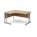 Dams Momento ergonomic oak desk with cantilever leg, featuring a spacious work surface and modern design.