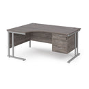 Dams Maestro 25 ergonomic desk with cantilever leg and fixed 3-drawer pedestal in grey oak finish, shown from the left side.